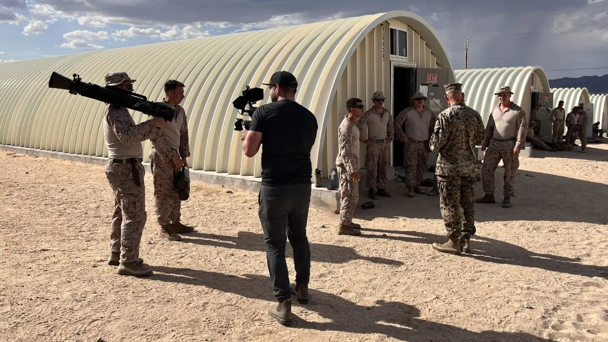 A group of soldiers standing around in front of a building.